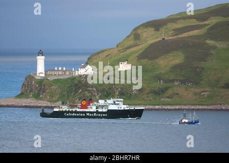 MV Isle of Arran passing Davaar Lighthouse. Stock Photo