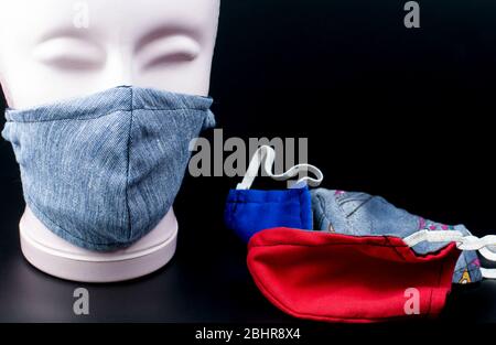 handmade face masks, community masks, made of different textiles during corona pandemic Stock Photo