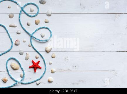 Marine items on turquoise painted wooden background. Sea objects on wooden planks. Stock Photo