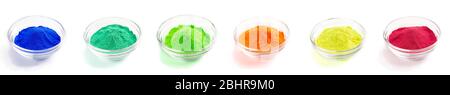 Dry paints in glass bowls. Yellow red blue and others Stock Photo