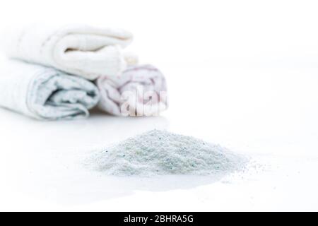 Laundry - Washing powder with clothes isolated on white background Stock Photo