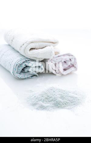 Laundry - Washing powder with clothes isolated on white background Stock Photo