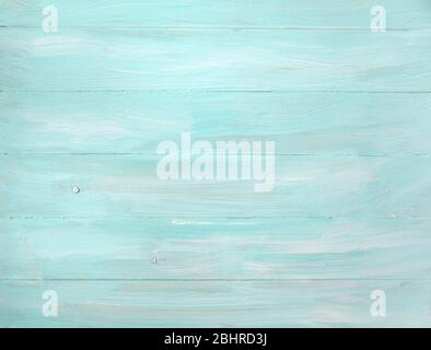 Rustic old plank background in turquoise, mint and beige colors with texture scratches and antique crackle paint. Top view. Copy space. Stock Photo
