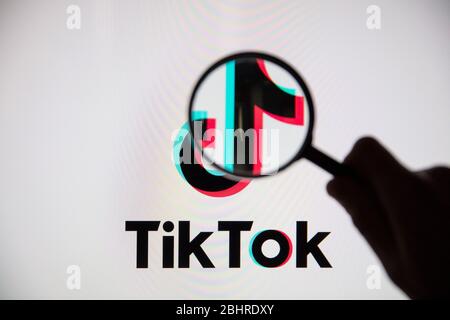 LONDON, UK - April 27 2020: Tik Tok social media app icon under magnifying glass Stock Photo