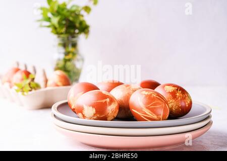 Naturally dyed with onion shells Easter eggs, springtime  plants, zero waste concept, sustainable living Stock Photo