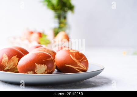 Naturally dyed with onion shells Easter eggs, springtime  plants, zero waste concept, sustainable living Stock Photo