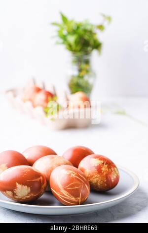 Naturally dyed with onion shells Easter eggs, springtime  plants, zero waste concept, sustainable living Stock Photo