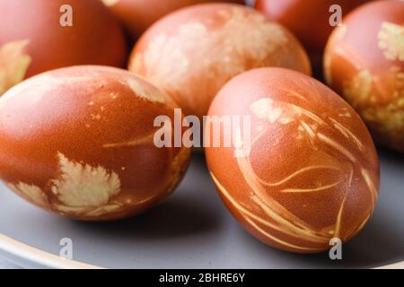 Naturally dyed with onion shells Easter eggs, springtime  plants, zero waste concept, sustainable living Stock Photo
