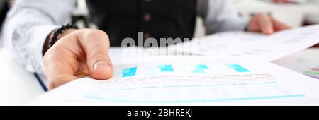 Man at home reviews and makes various report Stock Photo
