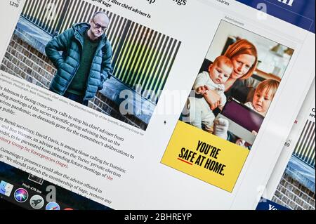 On-line public information Coronavirus/ Covid advert, 'You're safe at home' juxtaposed against an article and photo featuring Dominic Cummings. Stock Photo