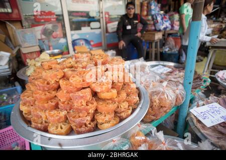 Sweet Dried Bael fruit on display on a street market in Samut Sakhon, Bangkok, Thailand. Stock Photo