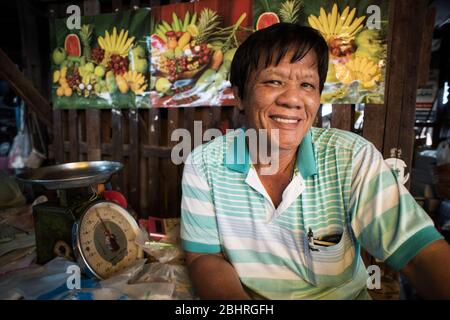 A fresh fruit seller at the Samut Sakhon street market, Bangkok, Thailand. Stock Photo