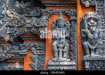 God of Hinduism sculpture figures in 'Pura Dalem' Hindu Temple in Ubud, Bali Stock Photo