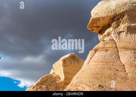 Low angle view of striped yellow rock formations in New Mexico Stock Photo