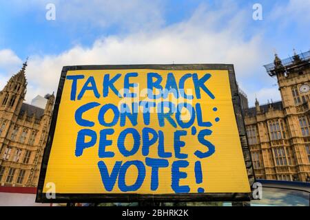 Take back control placard campaigning for a People's Vote on Brexit outside Parliament, London, UK Stock Photo