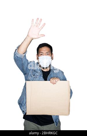 Bearded asian men worker dressed in jeans with medical mask and holding cardboard open hand doing stop sign in white background.The concept of protest Stock Photo