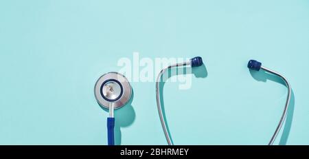 Phonendoscope on empty blue background, place for inscription. Concept of medivine. Stock Photo