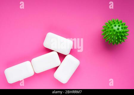 Symbolic virus or bacteria or germ cell targeted by soap bars. Epidemy prevention concept. Hygiene and health protection. Stock Photo