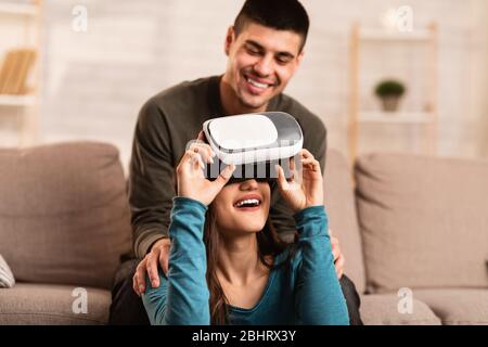 Smiling couple staying at home spending time together Stock Photo