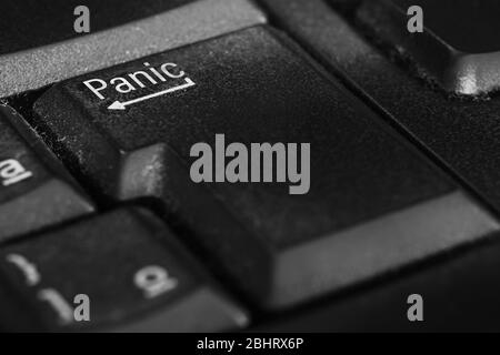 Panic button in place of the Enter key on the keyboard. Panic button for an emergency situation. Stock Photo