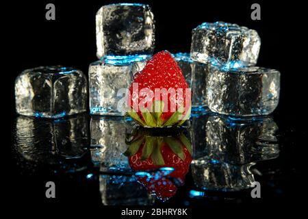 Sweet strawberries, shot on studio with two strobe lights with ice cubes on the background Stock Photo