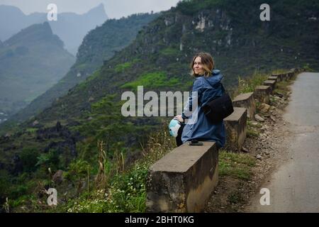 bakpacker young woman traveling through northern vietnam. Stock Photo