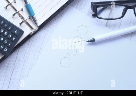 Black marking on checklist box with pen. Stock Photo