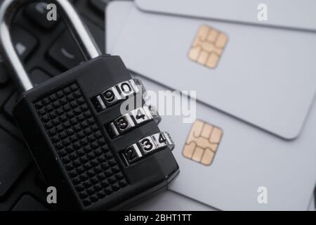 close up of padlock and credit card on keyboard. Stock Photo