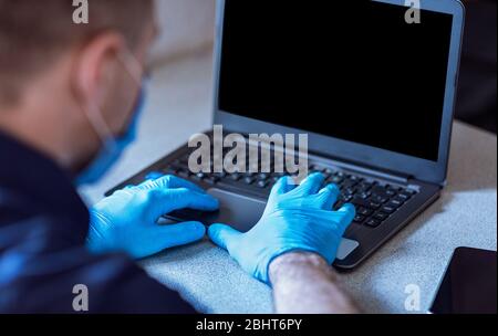 Unrecognizable Businessman Using Laptop Working Online From Home Stock Photo