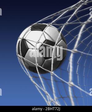 Goal. Football in the back of the net. Winning, Soccer ball. Success. Black and white traditional football, Stock Photo