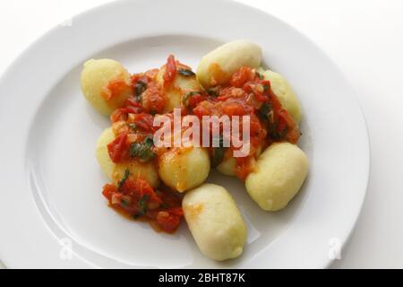 Gnocchi with tomato sauce and basil Stock Photo