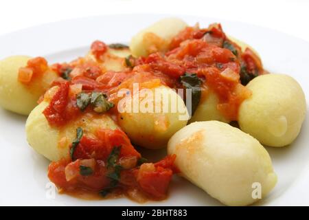 Gnocchi with tomato sauce and basil Stock Photo