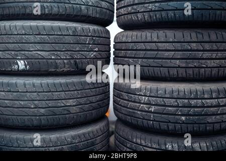 Tire sets in a car repair shop ready for a seasonal change on cars. Stock Photo