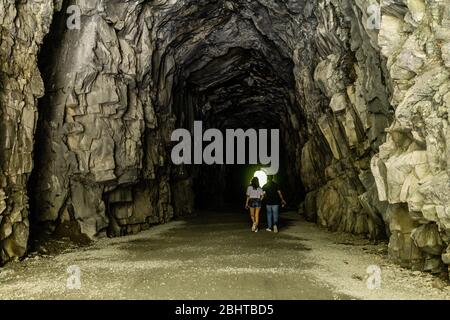 OTHELLO TUNNELS, CANADA - JULY 1, 2019: people walking in a huge tunnel near Hope british columbia. Stock Photo