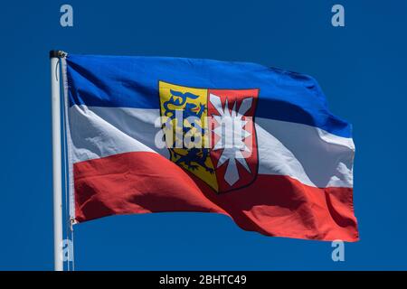 Flag of Schleswig-Holstein, with two the Schleswig lions and the thirteen-angled Holstein nettle leaf, Schleswig-Holstein, North Germany, Europeconcep Stock Photo