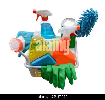 Vertical angled shot of a white plastic rectangular basket filled with cleaning supplies isolated on white. Stock Photo