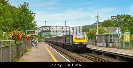 PONTYCLUN, NEAR CARDIFF, WALES - JULY 2018: Panoramic view of a First Great Western high speed train passing through Pontyclun railway station Stock Photo