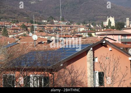 A house with solar panels on the roof Stock Photo