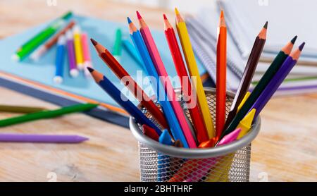 Colored pencils kept in pencil holder Stock Photo