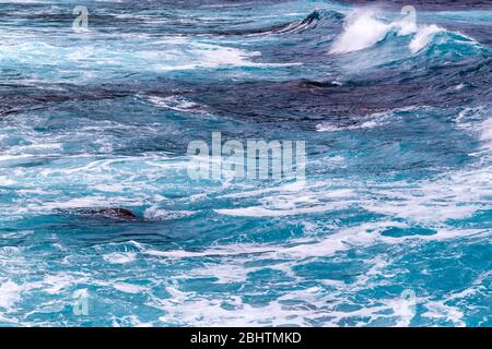 Natural background from foaming ocean waves, view from above. Stock Photo