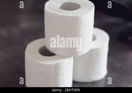 Close-up of the last pieces of   toilet paper rolls products for sale     on the  store shelf . Stock Photo