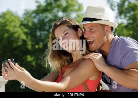 hipster couple taking a selfie on a summers day Stock Photo