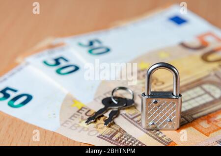 Lock and key on euro banknotes representing concept of financial control in the European Union. The economic future of Europe after the covid-19 crisi Stock Photo