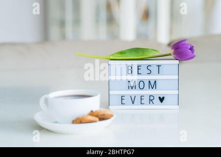 Cup of tea and card with words I love you Mom on table. Mother's Day  celebration Stock Photo - Alamy