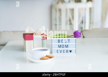 Cup of tea and card with words I love you Mom on table. Mother's Day  celebration Stock Photo - Alamy