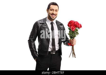 Handsome man in a leather jacket holding a bunch of roses isolated on white background Stock Photo