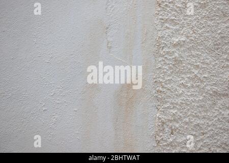 Old grunge beige plastered wall texture background Stock Photo