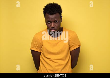 Young african american man looking down with guilty confused expression Stock Photo
