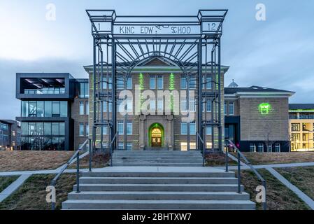 Calgary, Alberta - April 26, 2020: View of the facade of cSpace in Calgary at night. cSpace is a arts incubator and hub that was converted from a hist Stock Photo