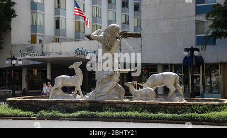 Mother Nature Fountain in front of The Aristocrat Manor Apartments at the intersection of Fountain Street and Central Avenue in The City of Hot Spring Stock Photo
